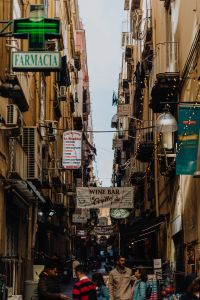 Kaboompics - Farmacia-Signed Narrow Shopping Street in Naples Old Town