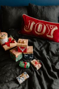 Kaboompics - Wrapped Holiday Presents in a Cozy Bedroom
