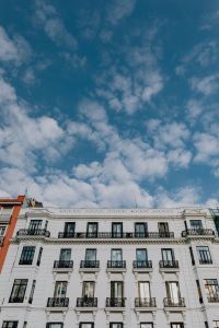 Kaboompics - Vertical Madrid Facade Beneath a Wide Pattern of Blue Sky Clouds
