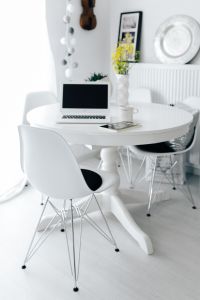 Workplace with laptop on table at home
