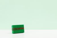 Kaboompics - Small Green Gift Box on Mint Green Background with Copy Space