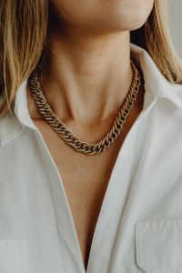 Kaboompics - Gold Chain Necklace Close-Up on White Shirt
