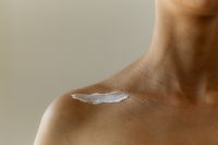 Kaboompics - Skincare Cream Applied to Shoulder Close-Up