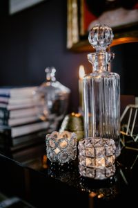 Kaboompics - Faceted Glass Votive Holders Beside a Crystal Decanter