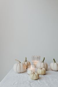 Kaboompics - White Mini Pumpkins and Candles on a Bright Table