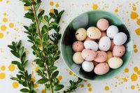 Kaboompics - Pastel Easter Eggs in a Ceramic Bowl with Greenery