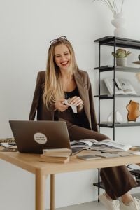 Kaboompics - Design Consultant Presenting Furniture Finish in Online Meeting