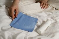 Kaboompics - Minimal Skincare Routine On White Bed Sheets