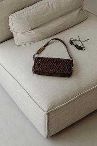 Kaboompics - Woven Brown Handbag on a Beige Sofa