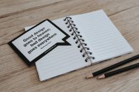 Kaboompics - Inspirational cards with quotes and a notebook