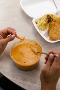 Kaboompics - Eating Shrimp Soup With Takeout Lunch
