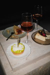 Kaboompics - Overhead Dessert Table with Cake and Wine