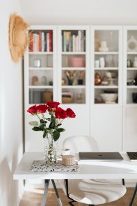 Kaboompics - Red Roses, Laptop and Candle on a White Home Office Desk