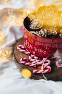 Kaboompics - Gingerbread Cookies and Candy Canes beside a Red Christmas Mug