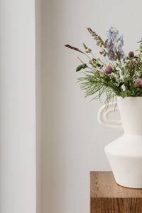 Kaboompics - White Ceramic Vase with Wildflowers against Neutral Wall