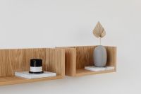 Kaboompics - Pampas Grass and Palm Vase with Candle on Two Wooden Wall Shelves