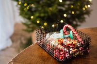 Kaboompics - Christmas Ornaments and Candy Canes in a Basket