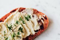 Kaboompics - Rustic Hummus Toast with Thyme on White Marble