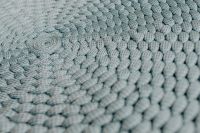 Kaboompics - Soft Gray Blue Braided Knit Pouf Texture with Shallow Depth of Field, Textile Background