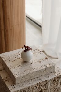 Kaboompics - Red Beaded Earrings on a Stone Pedestal