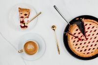Kaboompics - Blueberry Pie with Gold Spoon on a Plated Slice and Cappuccino