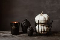 Kaboompics - Black Candle and White Pumpkins in Dark Halloween Still Life