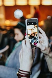 People taking photos with smartphones