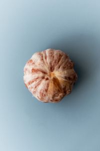 Kaboompics - Pink Grapefruit on Blue Background