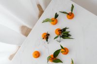 Fresh Tangerines on White Marble in Soft Curtain Light for Healthy Eating Content