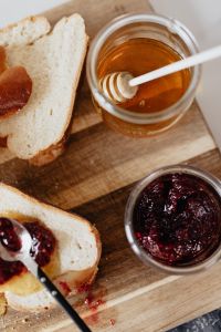 Kaboompics - Overhead Challah Slices With Honey and Raspberry Jam