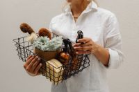 Kaboompics - Wire Basket with Cleaning Supplies and Dried Flowers