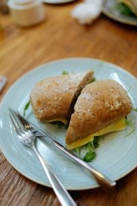 Kaboompics - Fresh Sandwich on Blue Plate With Fork and Knife
