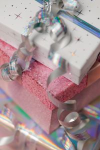Kaboompics - Stacked Glitter Gift Boxes with Silver Ribbon