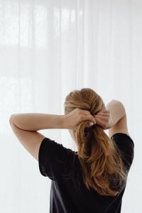 Kaboompics - Hands Pulling Hair into a Ponytail