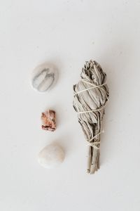 Kaboompics - White Sage Bundle and Three Stones for an Energy Cleansing Ritual