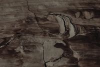 Kaboompics - Wide Charcoal-Taupe Paint Swirls with Raised Cracked Edges