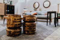 Kaboompics - Stacked Wooden Side Tables and Poufs in Contemporary Living Room