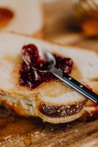 Kaboompics - Powdered Challah Crust Detail on Wooden Board