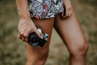 Kaboompics - Woman in a dress with a camera
