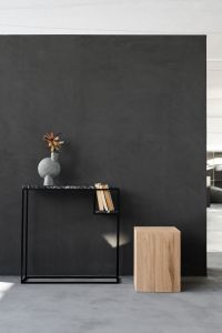 Kaboompics - Modern Living Room with Black Console Table, Sculptural Vase and Wooden Side Table
