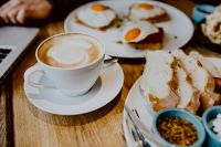 Kaboompics - Cappuccino and Toast with Fried Eggs in Soft Focus