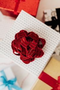 Kaboompics - Red Glitter Bow on Blue Dash Patterned Gift Wrap