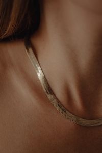 Kaboompics - Gold Chain Necklace on Woman's Shoulder Close-Up