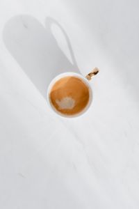 Cup of coffee on white marble