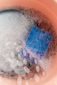 Kaboompics - Blue Sponge in Soapy Water