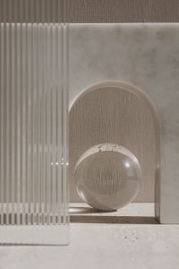 Kaboompics - Minimalist Glass Sphere and Ribbed Glass in an Arched Niche