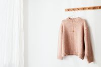 Kaboompics - Pink Knit Pullover Against White Background