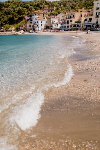 Kaboompics - Turquoise Mediterranean Water and Pebble Beach with Bathers in Marina di Puolo, Italy