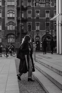 Kaboompics - Black and White Woman Walking in a Historic City Square