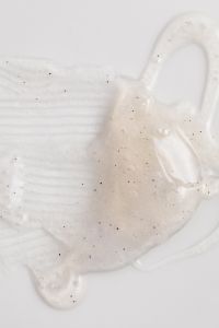 Kaboompics - White Skincare Cream Swatch with Fine Specks and a Ridged Swipe